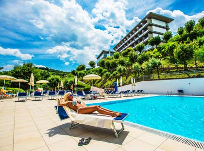 Girl relaxes by the pool